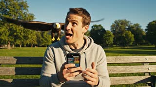 guy checking his phone wanting to make a trade in fantasy football. he says to himself "oh my i want to fleece this guy so bad" then a predatory animal flys in from the sky and picks up the guy and flys away with him. the words "trade like a predator" are written in the sky