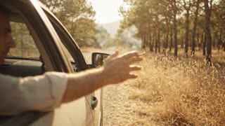 A realistic cinematic shot of a quiet forest road in Turkey on a very hot summer afternoon, pine trees, dry grass near the roadside, warm sunlight, a parked family car near the edge of the road, peaceful but fragile nature atmosphere, slow cinematic push-in, documentary public service announcement style, vertical 9:16, no text, no logo, no watermark, no fire, no smoke.

Realistic cinematic public service announcement short film, hot summer day in Turkey, forest road and dry grass near pine trees, a parked car on the roadside, an adult in the car almost throws a cigarette butt out of the window, a child or teenager in the back seat notices and silently warns the adult, the adult realizes the danger, safely puts out the cigarette butt in a small metal container or car ashtray, calm but serious atmosphere, natural acting, warm sunlight, dry summer landscape, documentary realism, shallow depth of field, soft film grain, vertical 9:16, no text, no logo, no watermark, no cartoon, no animation, no fire.

Genel Negatif Prompt: wildfire, flames, burning forest, disaster scene, smoke cloud, panic, injured animals, dead animals, blood, violence, crying child, scary scene, destroyed houses, war, explosion, cartoon, animation, 3D, exaggerated acting, text, logo, watermark, distorted hands, extra fingers, deformed faces, unrealistic movement.