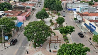 The scene moves throughout the entire space, from beginning to end.
Maintain the exact design and characteristics of the image; do not make any changes to the current design.

Vehicles drive along the road, respecting traffic laws, the direction of the road, and a safe distance between them. Tree foliage with slight movement in the wind. in a cinematic scene with professional lighting, shallow depth of field, and movie-quality visual effects
