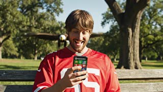 guy checking his phone wanting to make a trade in fantasy football. he says to himself "oh my i want to fleece this guy so bad" then a predatory animal flys in from the sky and picks up the guy and flys away with him