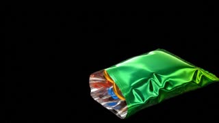 Animate the image with smooth, realistic 3D motion. Colorful, glossy musical notes emerge directly from inside the open mouth of the green metallic bag, then float upward in a beautiful spiral motion. The notes rise continuously from the bag opening, moving upward and slightly to the left, gradually spreading out as they gain height. Smaller notes emerge first, followed by larger colorful musical notes and golden treble clefs. Each note rotates gently in 3D space, reflecting vibrant highlights with subtle colorful light trails. Add a few tiny sparkling particles around the notes.

**BACKGROUND:** Pure solid black (#000000) across the entire frame, completely uniform and consistent, with no gradients, no texture, no shadows on the background, and no transparency checkerboard. The black background must remain perfectly black throughout the entire animation for easy chroma key removal in Adobe Premiere Pro.

Keep the green metallic bag completely stationary, preserving its original shape, metallic reflections, wrinkles, lighting, and exact position. Maintain the original camera angle and composition. All musical notes and particles must be clearly visible against the black background, with clean edges and no black glow or dark outlines around them.

Static camera, no zoom, no camera movement, no distortion, no changes to the bag, no extra objects, no text. The musical notes must originate naturally from inside the bag opening and travel upward continuously, never appearing suddenly in midair. Smooth cinematic animation, realistic depth, high-quality 3D rendering, consistent motion throughout the clip.