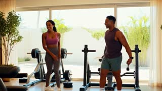 Create a realistic cinematic commercial scene featuring a fit Caribbean couple in their 30s exercising together in a bright, beautiful home gym.

The couple has just finished a workout. They are smiling, slightly sweaty, energized, and relaxed. They finish their workout and walk over to a kitchen counter where the exact Sea Moss Gel product from the uploaded reference image is sitting.

The woman picks up the exact Sea Moss Gel jar while the man stands beside her. She opens the jar, scoops one spoonful of the gel, and they each enjoy a spoonful.

Keep the focus on the couple and the product. The mood should communicate healthy lifestyle, family, togetherness, Caribbean energy, and daily wellness.

PRODUCT ACCURACY IS CRITICAL: Use the uploaded product image as the exact reference. Do not redesign or modify the jar, label, logo, lid, colors, shape, or packaging. Do not create a different product. Do not add additional jars or brands.

CAMERA: Start with a medium shot of the couple finishing their workout. Smoothly follow them as they walk to the counter. End with a close-up of the actual Sea Moss Gel jar and the spoon.

STYLE: Photorealistic, premium commercial, natural Caribbean-inspired aesthetic, warm natural lighting, realistic human movement, cinematic depth of field.

NO: text, subtitles, floating graphics, medical imagery, exaggerated muscles, unrealistic movements, product redesign, extra products, distorted hands, distorted faces.