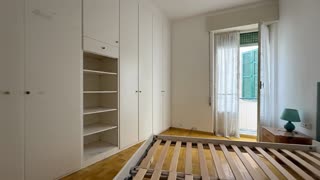 reate a cinematic before-and-after transformation video of this room. Start with the original room exactly as in the photo, then gradually transform it into a fully renovated modern interior. Keep the windows in the exact same position and maintain the original room layout and structure. Replace the old furniture with elegant modern furniture and redesign the space with high-end contemporary materials: light wood or parquet flooring, clean white walls, modern lighting, minimalistic design, and stylish contemporary decor. The renovation should feel realistic and architecturally coherent, as if it were professionally redesigned by an interior designer. The transformation should be smooth and visually impressive, showing the room evolving from old to modern luxury. Ultra realistic rendering, natural lighting, cinematic animation, ultra-detailed textures, photorealistic, 8K resolution.