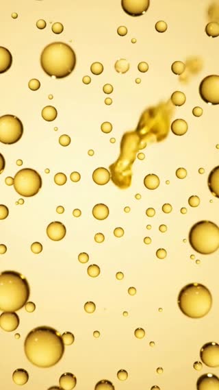 A close-up commercial product shot on a solid flat background in pale cream-yellow color (#FFF5B8), completely seamless with no gradients or shadows.

Dozens of realistic water droplets in a warm golden-yellow color (#FFF248) float and drift across the frame. The droplets have a clear, glossy, translucent water texture — they behave and refract light like real water (visible highlights, soft caustic reflections, slight lens-like distortion of the background through each droplet), while still carrying a rich golden-yellow tint, like tinted water or juice.

The droplets slowly move, ripple, and gravitate toward the center of the frame. They merge, stretch, and reshape themselves smoothly into bold letterforms, assembling to spell out the word "Dfresh" in a thick, modern, geometric sans-serif style (Pretendard Black weight — heavy, rounded, high-contrast strokes).

Once the typography "Dfresh" is fully formed from the merged droplets, the surface settles with a subtle wet glisten and soft highlight sweep across the letters, then holds for a beat.

Style: clean commercial beauty/skincare product aesthetic, soft studio lighting, macro lens look, smooth fluid motion, no camera shake, minimal and elegant.
Camera: static or very slow subtle push-in, centered composition.
Duration: 6 seconds. Vertical format (9:16).

Negative prompt: no text artifacts other than "Dfresh", no extra objects, no background texture, no harsh shadows, no glitter/sparkle overlay, no additional colors.