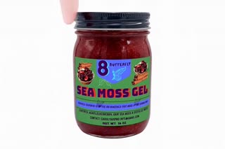 Show a healthy-looking adult adding the Sea Moss Gel to a smoothie, breakfast bowl, or taking a spoonful. Keep the product visible in the scene.